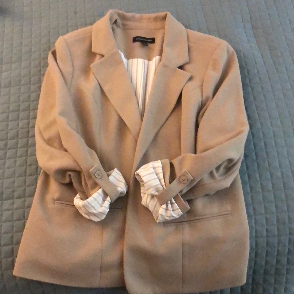 Beige blazer with striped insert shown on sleeves slightly worn